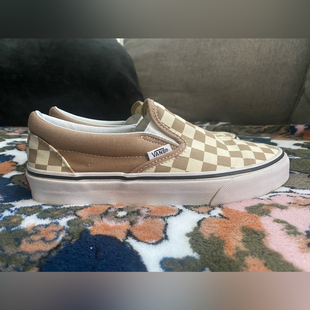 Vans. Women 7/men 5.5. Checkered slip on.